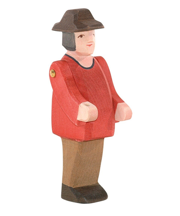 ostheimers wooden farmer figure with a red shirt, tan trousers and a brown farmers hat