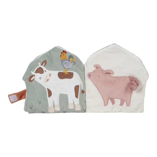 little dutch cow and pig characters inside the soft activity book