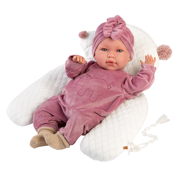 llorens baby doll in a velvet pink onesie named abril