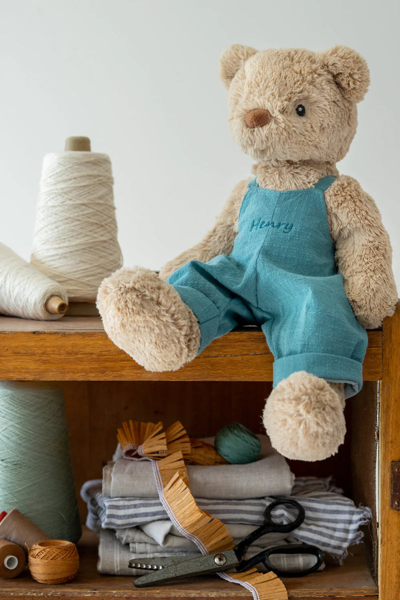 nan huchy soft toy bear with blue overalls on