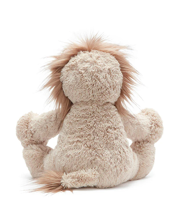the lion soft toy from the back with a beige tail