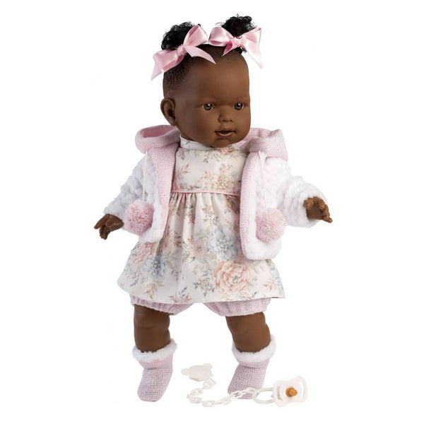Doll with floral dress and pink jacket on a white background