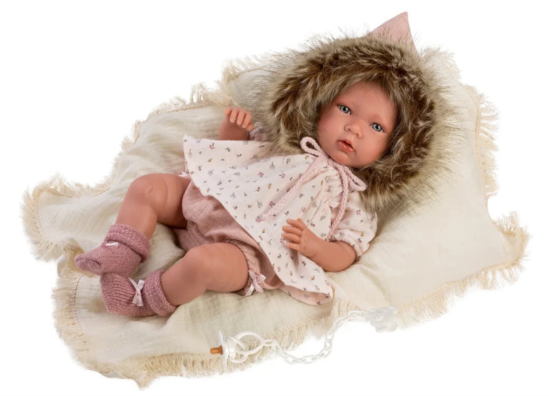 Realistic baby doll in a fur coat and dress on a white background