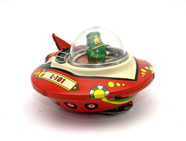 tin toy wind up commander space ship with a little green driver