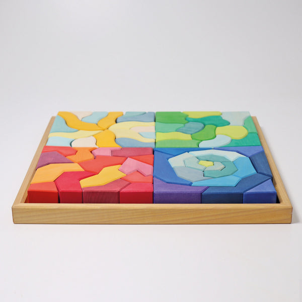 the the grimms four temperaments wooden blocks building set in its wooden tray showing the puzzle put together