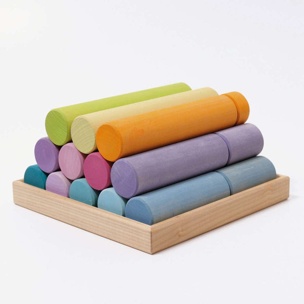 the grimms large pastel rollers 12 stacked in a natural wooden box