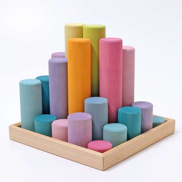 the grimms large pastel wooden rollers standing up vertically to show the different colours and block lengths