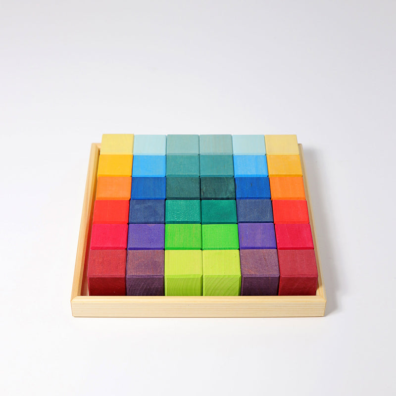 a tray of rainbow wooden blocks from grimms toys 
