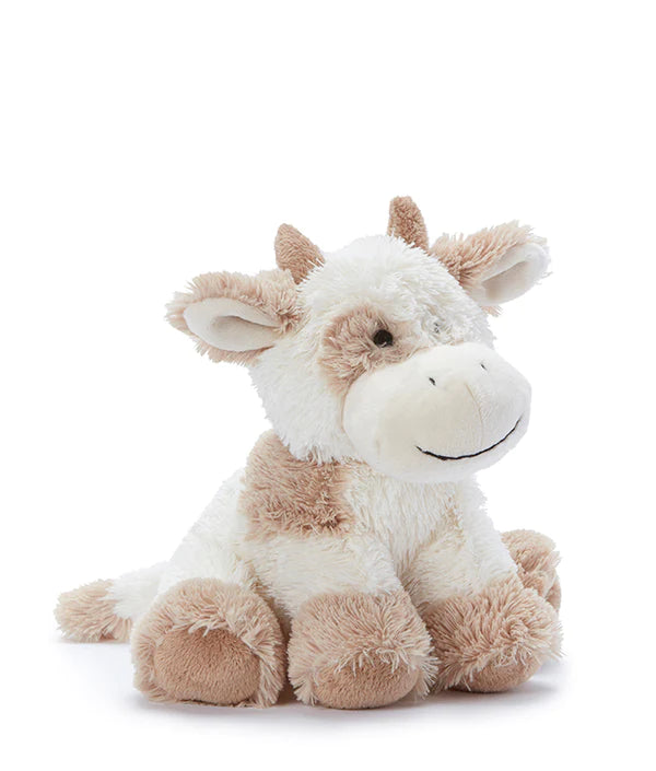 beige and white cow soft toy sitting down
