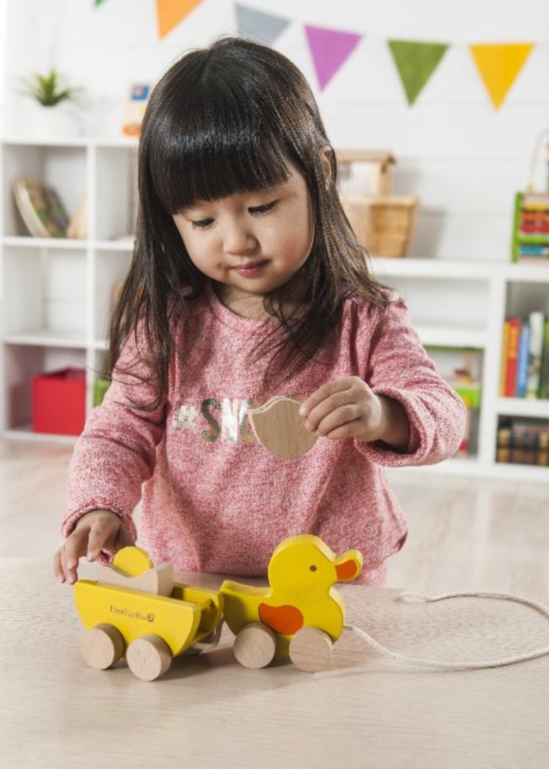 everearth pull along duck with egg yellow wooden toys for children girl playing