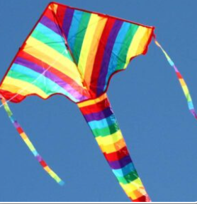 a rainbow childrens kite flying in the sky by windspeed kites available at childplay toy shop