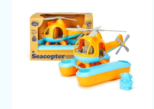 a green toys orange and blue helicopter 