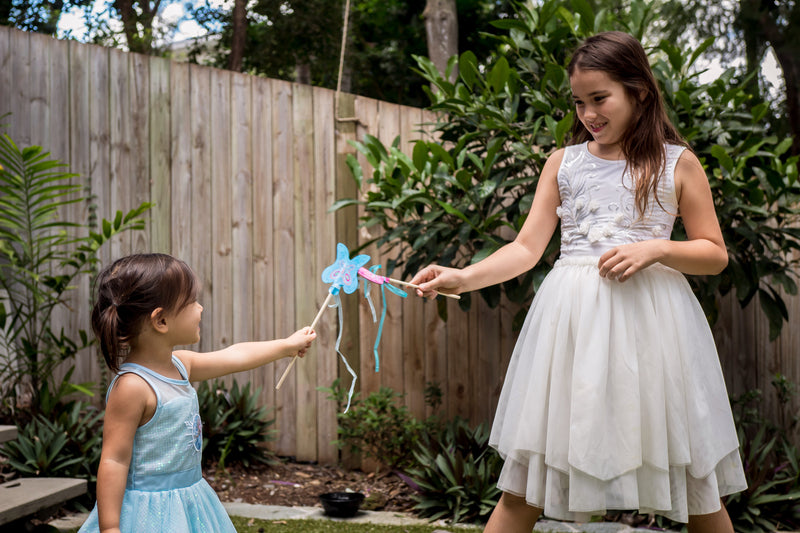 Djeco wands playtime, 2 fairy girls in the backyard.