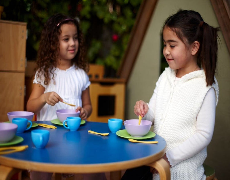 two children play wth the green toys dinner set