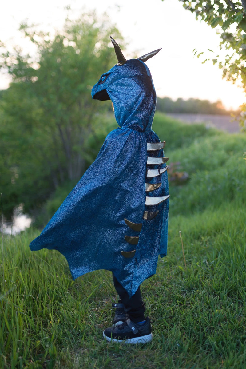 showing the shiny gold spikes down the back of the dragon costume kids cape