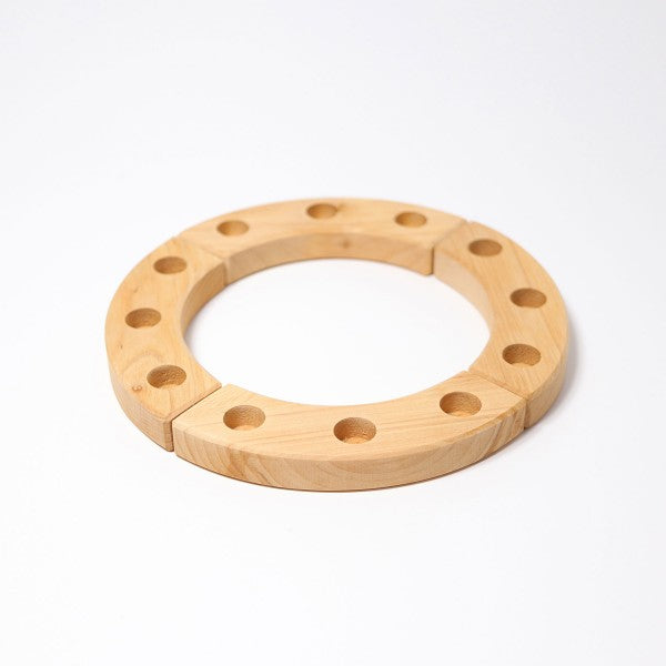 the grimms wooden small birthday ring in natural with four pieces each with three holes 