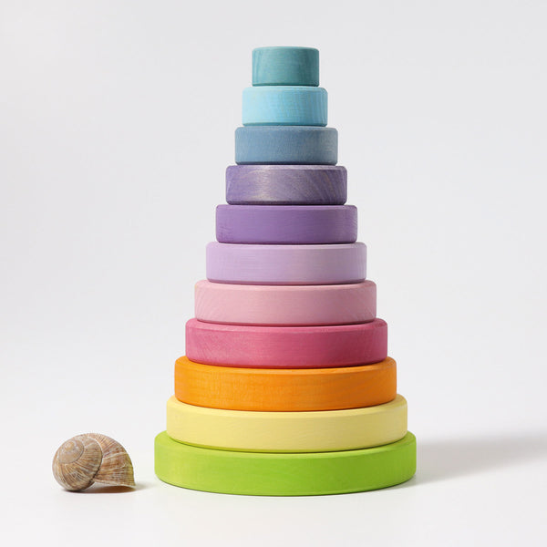 grimms pastel wooden conical tower stacked together to show the size and colours