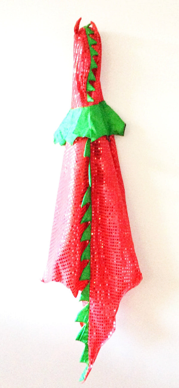 a sequined dragon cape in red with green padded spiked all the way down the back