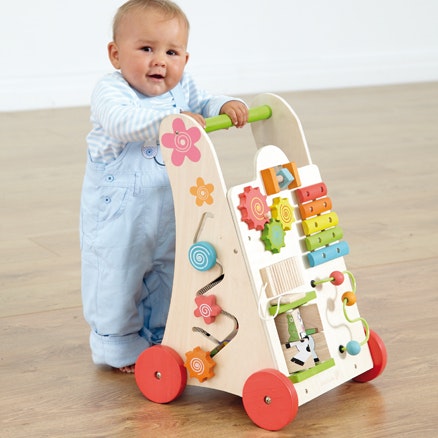 A wooden activity walker to entertain children and encourage walking.