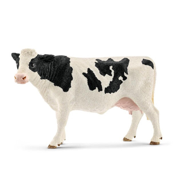A detailed cow figurine. The  holstein cow has distinct black and white colour features. Size height 9 cm,  length 13 cm , width 4.5 cm Recommended age 3 - 8 years