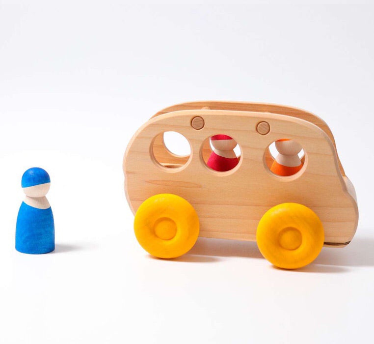 grimms wooden bus with three wooden people inside