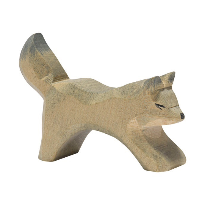ostheimer wooden wolf figurine is a smaller version and is running