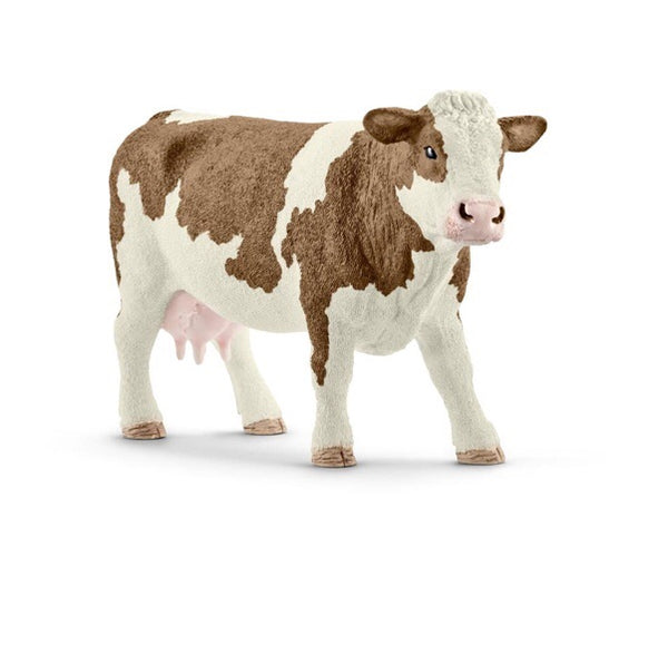 A detailed cow figurine. The simmental cow has distinctive patch colour features of light gold to reddish brown. A beautiful animal. Size height 7.5 cm,  length 13 cm , width 4.5 cm 