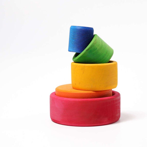 Grimm's wooden coloured bowls for stacking play and recommended for ages 1+.
