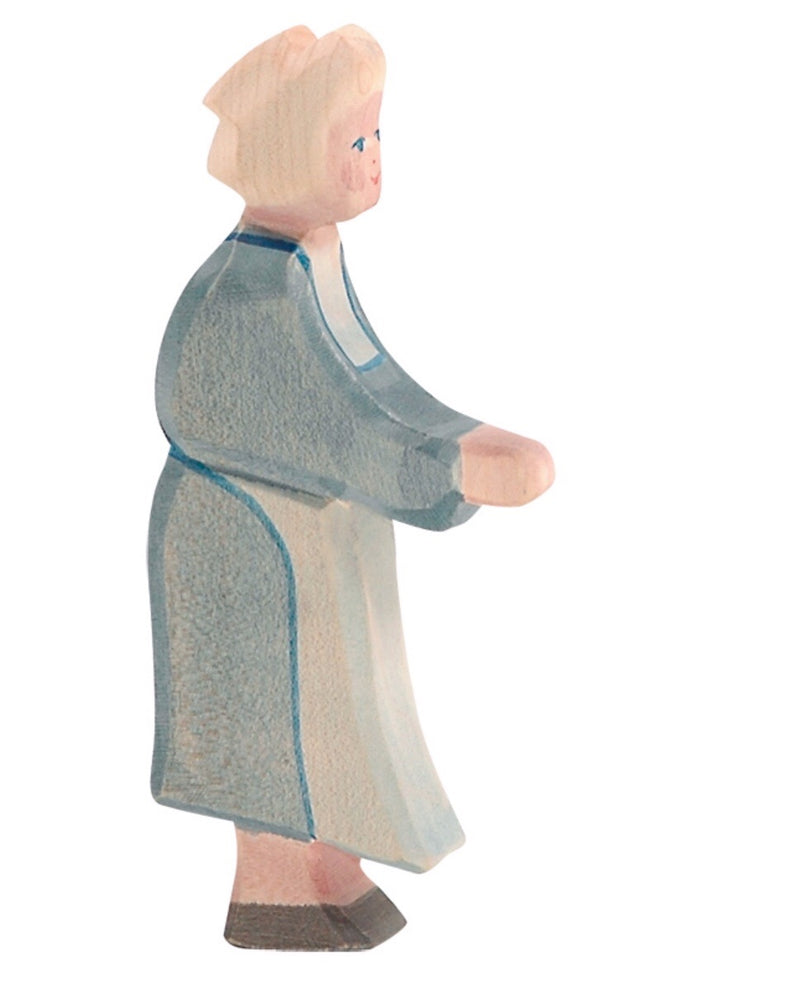 ostheimer wooden grandma figurine with very light blonde hair and a blue dress on