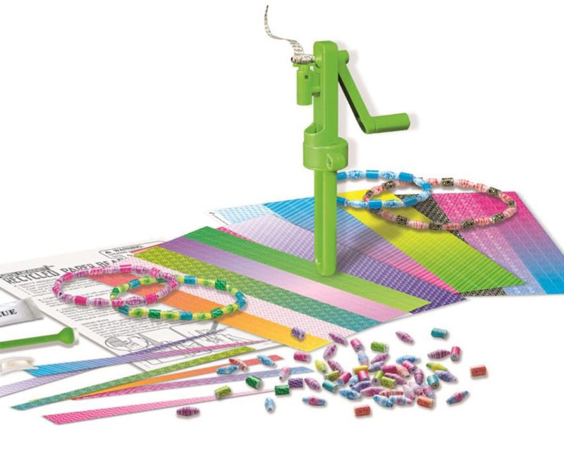 A picture of the Green Science boxed kit including colored papers, twisting device and samples of the recycled paper beads.