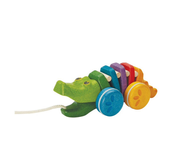 Plan Toys Alligator is an active first pull along toy for ages 1+. A colouful body & and a click-clack sound when it moves. 