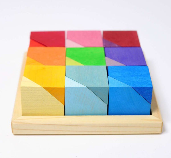 Gorgeous blocks stacked in wooden tray. Grimms multicolour wooden toys