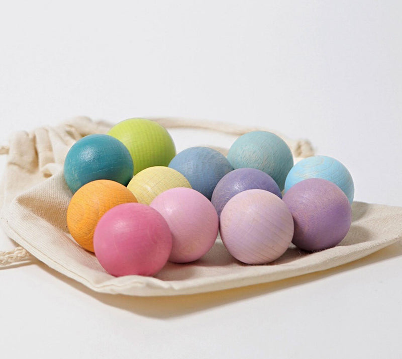 Grimms Pastel wooden balls. Beautiful colours. Comes with a Calico bag