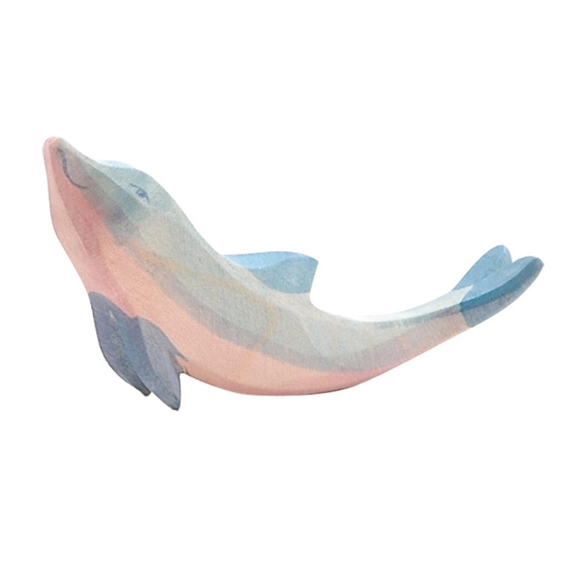 a handcarved wooden dolphin with soft blue painted on it