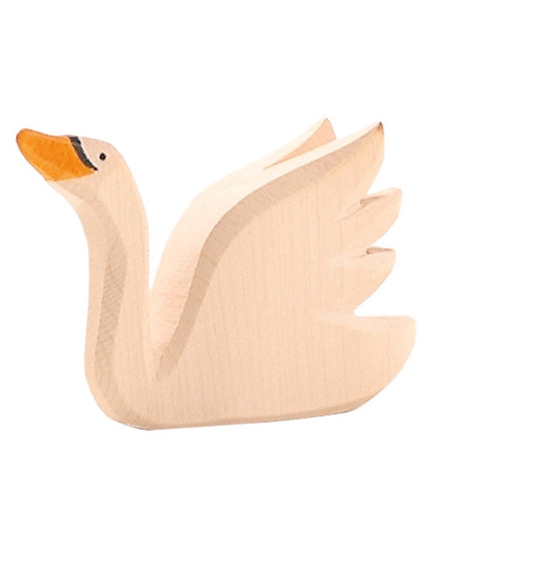 wooden swan with its head pointing up by ostheimer wooden toys