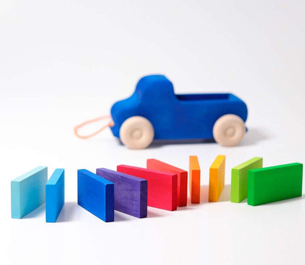 grimms wooden car in a bright blue with natural wooden wheels and a set of 10 rainbow wooden dominos