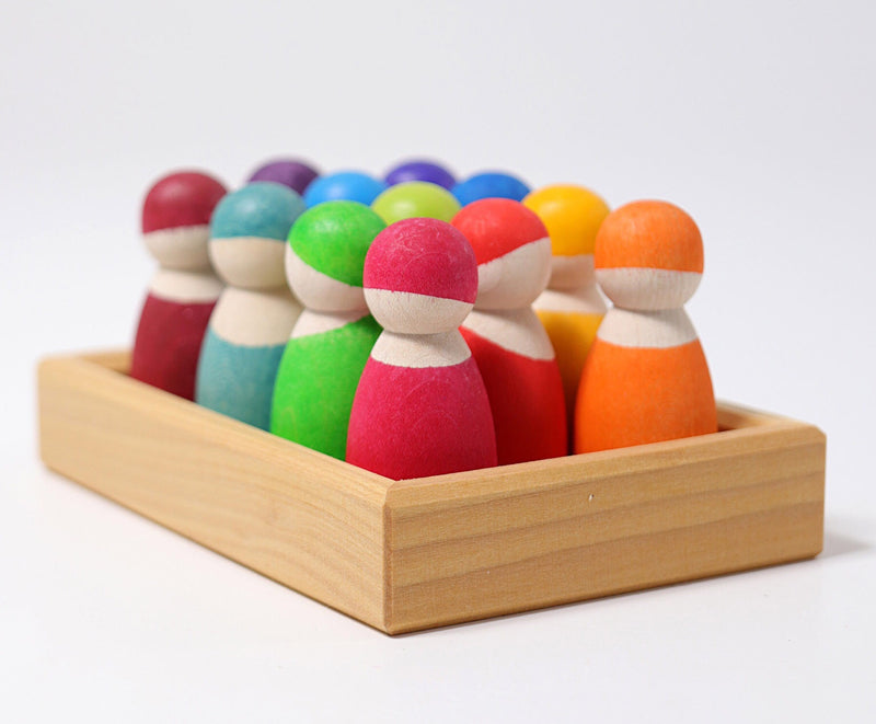 the rainbow wooden friends set from grimms with the 12 figurines all together in a wooden tray
