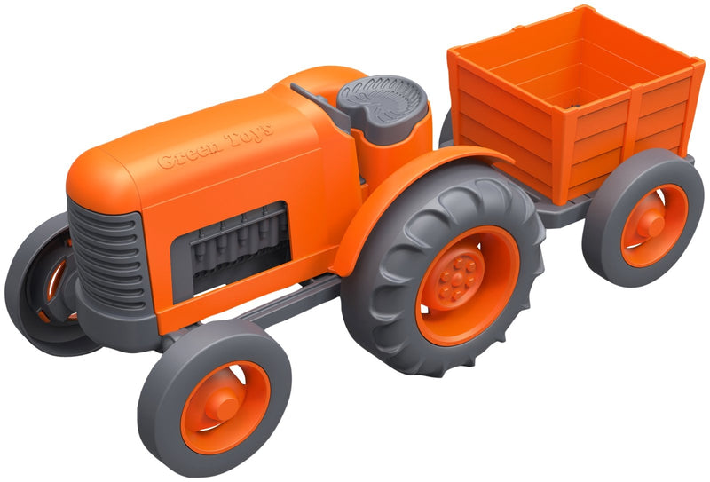 green toys tractor for imaginative play. A two piece vehicle , bright orange in colour and ready for moving.  
