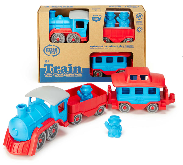 green toys train set with red and blue details and three carriages and two bear characters inside
