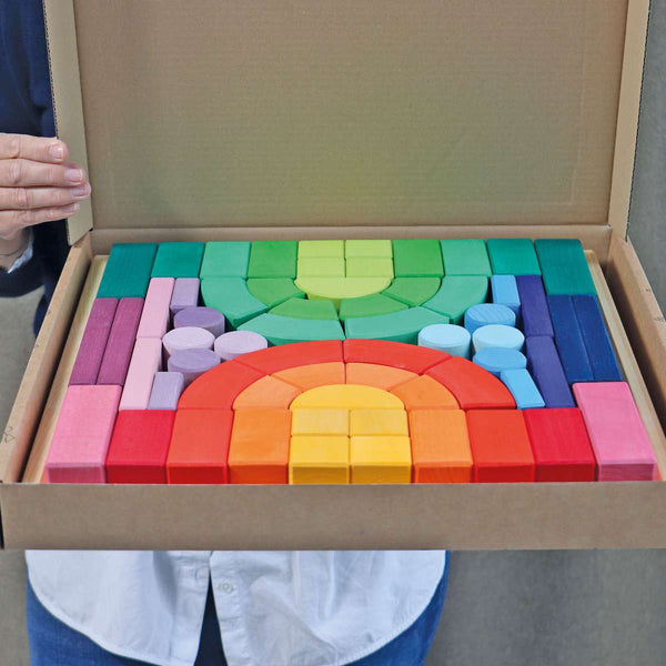 grimms romanesque rainbow building blocks in a natural wooden tray 